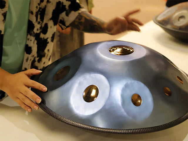 Woman trying the handpan "Starlight" made by handpanuni