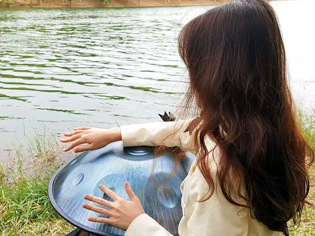 A young lady playing handpan "Sunshine“ made by handpanuni